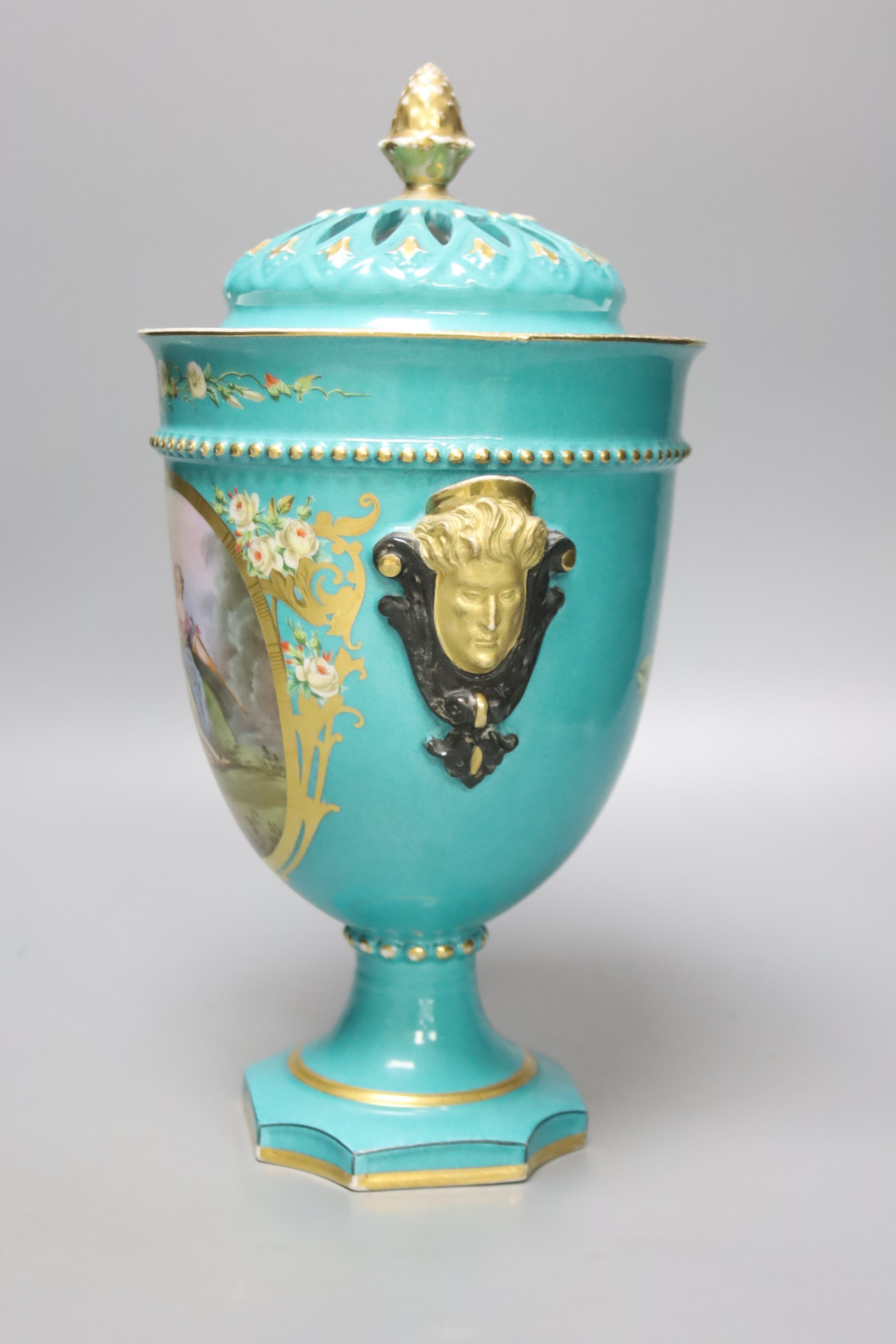 A 19th century French porcelain pot pourri vase, turquoise green ground with a pierced cover, height 30cm overall